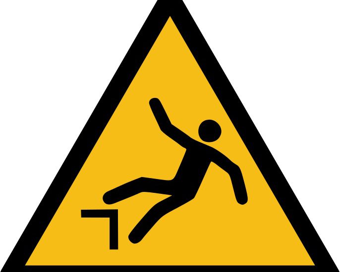 A warning sign to stress worker safety - this one warns people about falling off a step