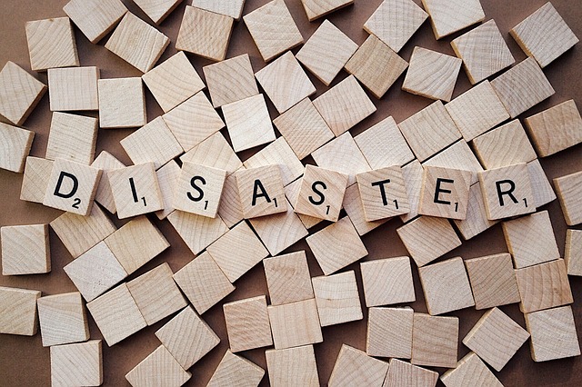 Disaster spelled out on Scrabble tiles. Disaster recovery involves a lot of tiny parts working together.