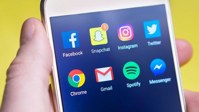 Social media apps on a mobile phone.