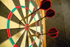 Three darts stuck in a dartboard. Sometimes it seems this is the best way to make decisions. And it's all you have if you don't measure your results.