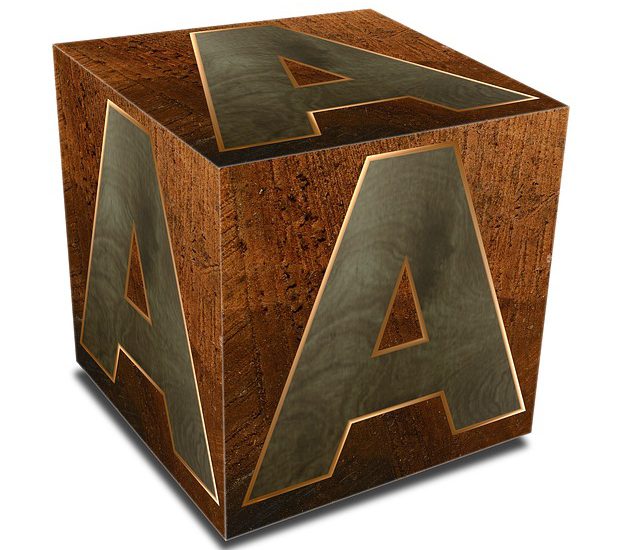 A photo of a fancy wooden block with the letter A on all three sides. This is a metaphor for a blockchain block.