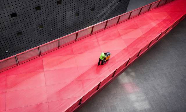 A red walkway floor in a clean factory. They probably practice just-in-time manufacturing to keep it that clean.