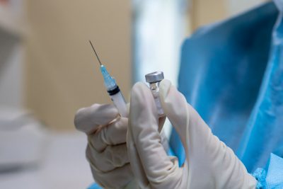 Photo of a vaccine and syringe. In some cases, employers CAN require their workers to get a COVID vaccine.