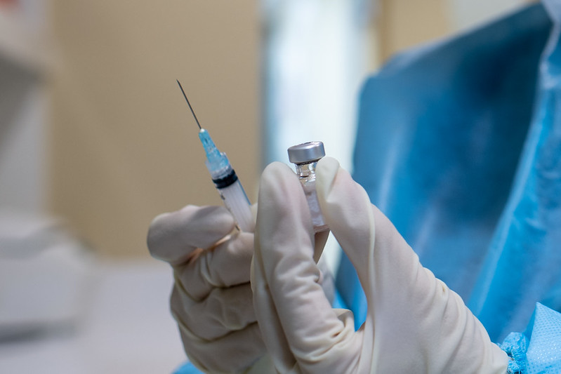 Photo of a vaccine and syringe. In some cases, employers CAN require their workers to get a COVID vaccine.