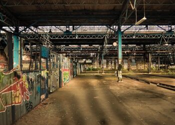 An abandoned factory that has been emptied of machines and workers.