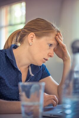 A woman who looks like she was promoted to a manager position she wasn't ready for.